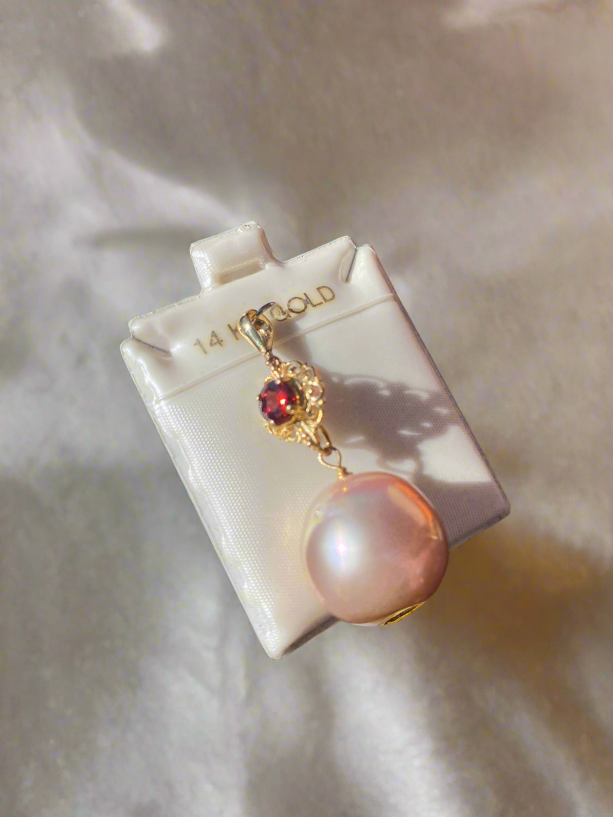 14K gold pearl pendant, pink pearl necklace, gold and garnet jewelry, luxury pearl pendant, garnet and pearl charm, vintage-inspired pearl pendant, elegant pink pearl jewelry, garnet accent necklace, statement pearl necklace, pink pearl and gold pendant, fine jewelry gift ideas, unique pearl jewelry, gemstone and pearl necklace, handcrafted pearl pendant, 14K gold pink pearl charm