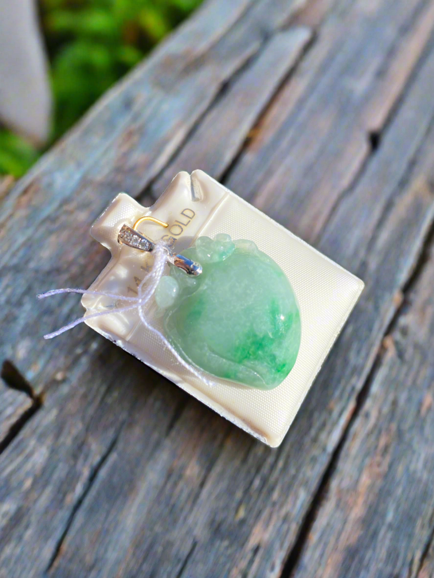 Jade heart pendant, jade and diamond necklace, green jade jewelry, heart-shaped jade pendant, jade talisman necklace, harmony and love symbol jewelry, diamond-accented jade pendant, jade healing crystal necklace, sterling silver jade pendant, unique gemstone heart pendant, spiritual jade necklace, luxury jade jewelry, green gemstone heart pendant, handcrafted jade and diamond necklace, jade charm for balance and love