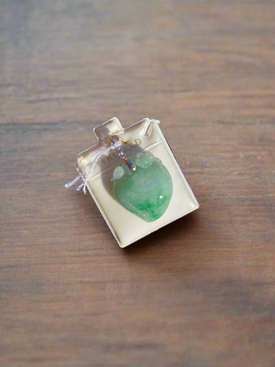 Jade heart pendant, jade and diamond necklace, green jade jewelry, heart-shaped jade pendant, jade talisman necklace, harmony and love symbol jewelry, diamond-accented jade pendant, jade healing crystal necklace, sterling silver jade pendant, unique gemstone heart pendant, spiritual jade necklace, luxury jade jewelry, green gemstone heart pendant, handcrafted jade and diamond necklace, jade charm for balance and love