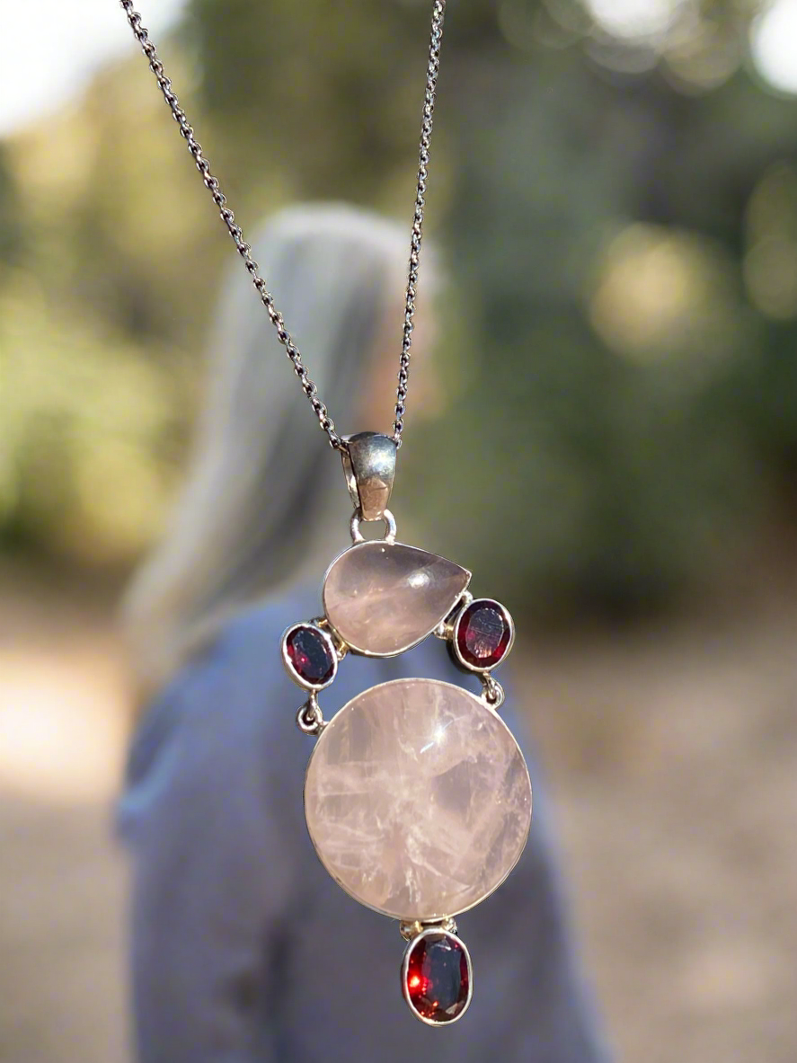 Rose quartz and garnet pendant, love crystal necklace, garnet and rose quartz jewelry, passion and love talisman, rose quartz heart chakra necklace, gemstone love pendant, romantic crystal jewelry, healing rose quartz necklace, garnet energy jewelry, spiritual love necklace, unique gemstone pendant, rose quartz and garnet charm, handcrafted crystal jewelry, chakra balancing necklace, rose quartz gift for her.