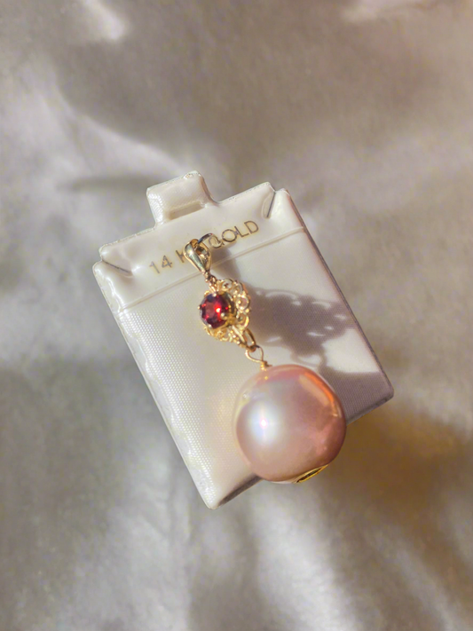 14K gold pearl pendant, pink pearl necklace, gold and garnet jewelry, luxury pearl pendant, garnet and pearl charm, vintage-inspired pearl pendant, elegant pink pearl jewelry, garnet accent necklace, statement pearl necklace, pink pearl and gold pendant, fine jewelry gift ideas, unique pearl jewelry, gemstone and pearl necklace, handcrafted pearl pendant, 14K gold pink pearl charm