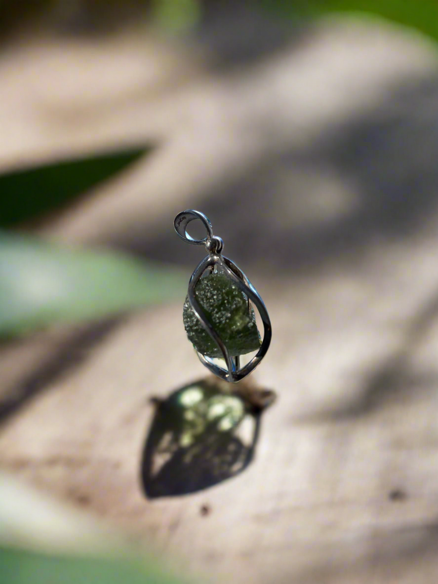 Moldavite pendant, moldavite tektite necklace, chakra alignment jewelry, high-vibration pendant, spiritual transformation necklace, genuine moldavite pendant, ascension crystal jewelry, sterling silver moldavite charm, metaphysical moldavite necklace, raw moldavite jewelry, healing tektite pendant, moldavite energy necklace, unique moldavite gemstone jewelry, spiritual awakening pendant, moldavite for chakra balance