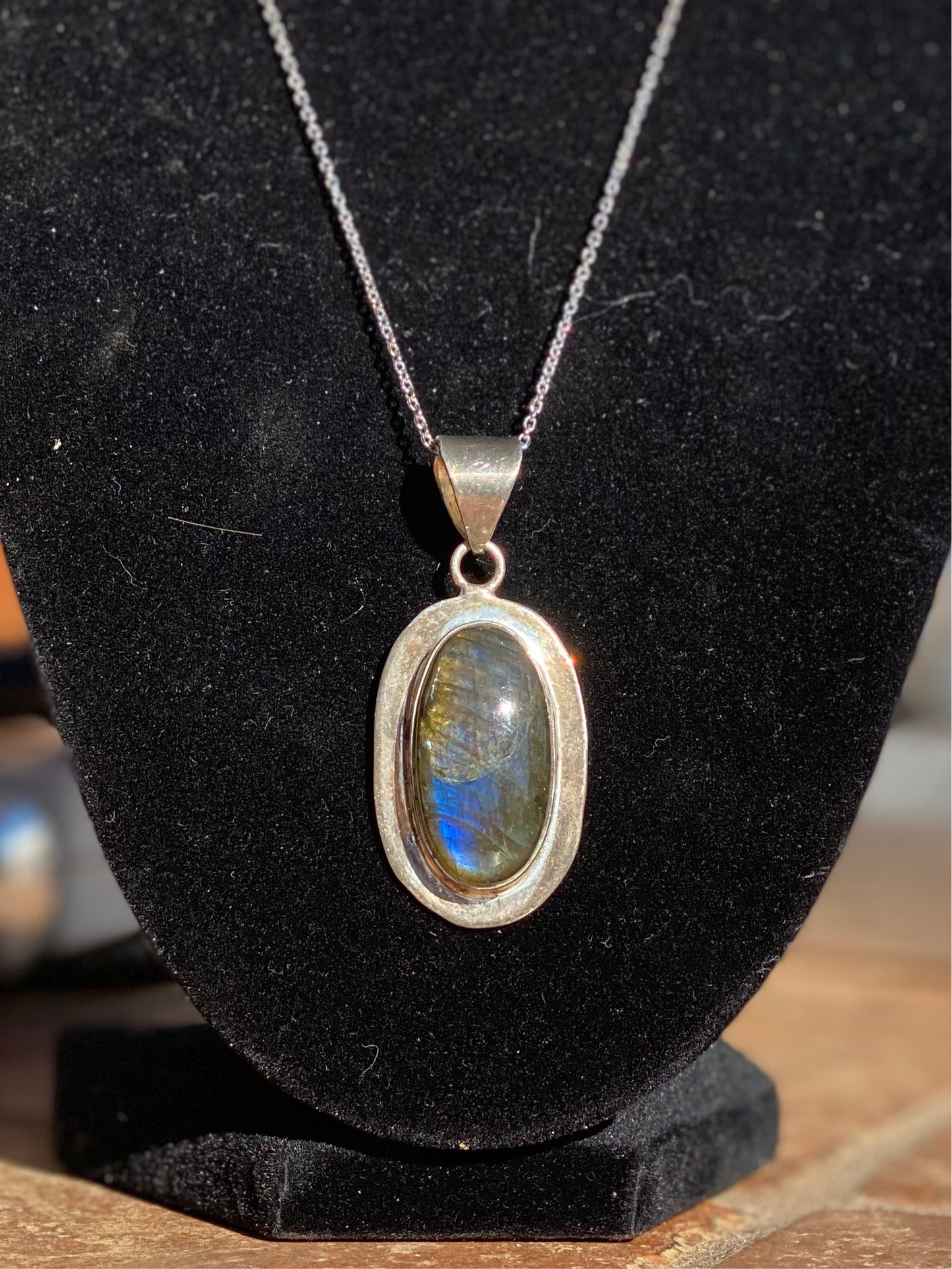 Labradorite crystal pendant, handcrafted labradorite necklace, oval labradorite charm, mystical labradorite jewelry, gemstone energy pendant, iridescent labradorite stone, spiritual crystal necklace, healing labradorite pendant, metaphysical labradorite jewelry, protective stone necklace, chakra-balancing jewelry, unique gemstone pendant, shimmering labradorite necklace, Labradorite pendant for transformation, holistic crystal jewelry