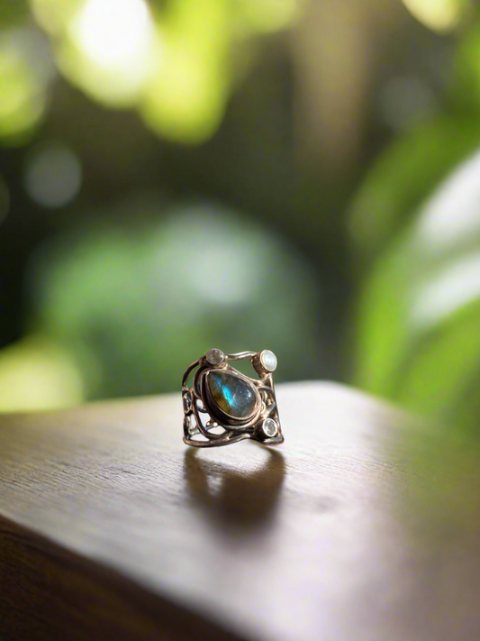 Labradorite and moonstone ring, mystical gemstone ring, artisan-crafted labradorite ring, moonstone and labradorite jewelry, spiritual gemstone ring, labradorite moonstone band, bohemian gemstone jewelry, healing crystal ring, moonstone for intuition ring, labradorite for protection ring, unique gemstone ring, handcrafted labradorite moonstone ring, chakra balancing ring, natural stone jewelry, labradorite and moonstone statement ring
