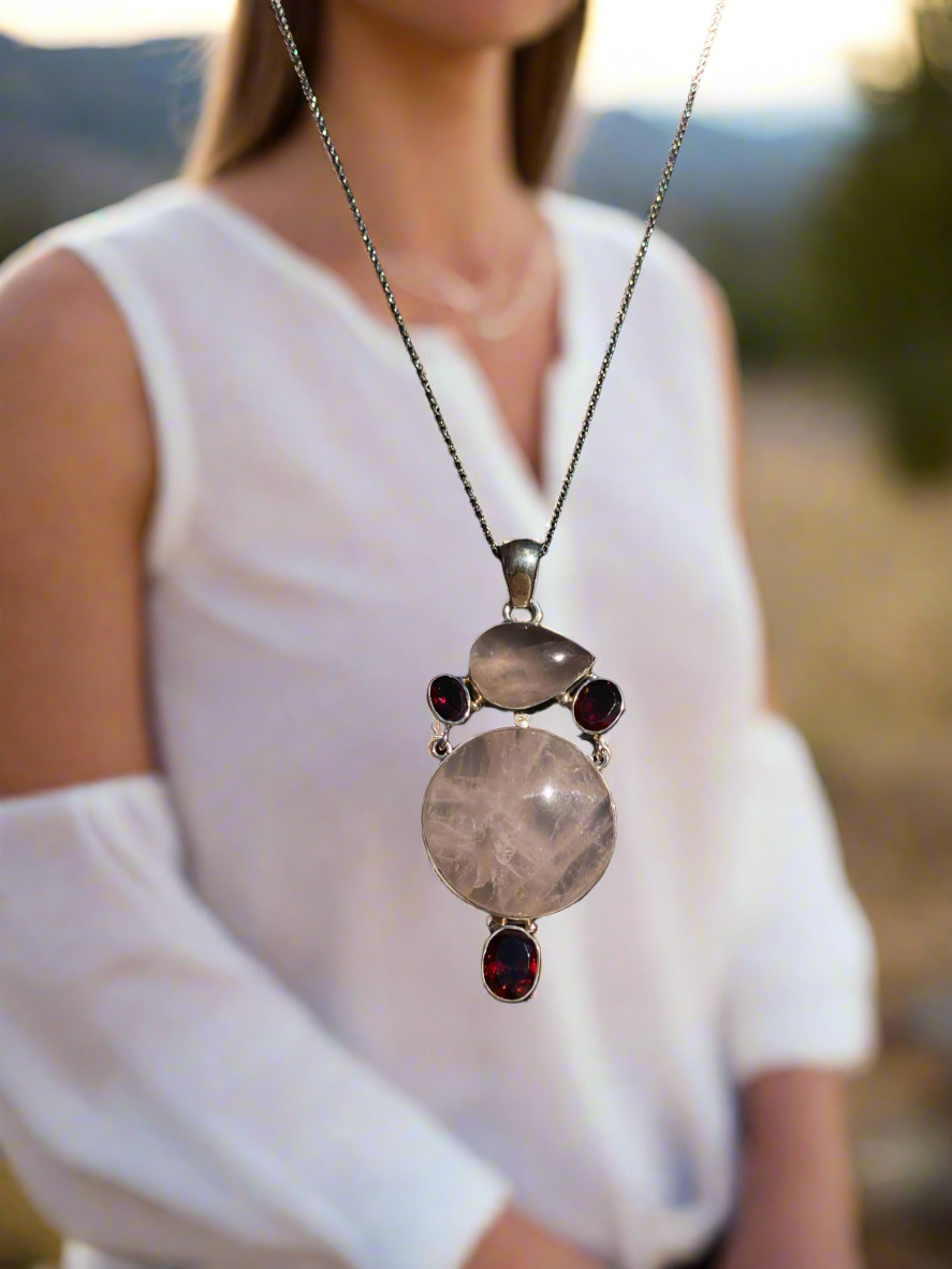 Rose quartz and garnet pendant, love crystal necklace, garnet and rose quartz jewelry, passion and love talisman, rose quartz heart chakra necklace, gemstone love pendant, romantic crystal jewelry, healing rose quartz necklace, garnet energy jewelry, spiritual love necklace, unique gemstone pendant, rose quartz and garnet charm, handcrafted crystal jewelry, chakra balancing necklace, rose quartz gift for her.