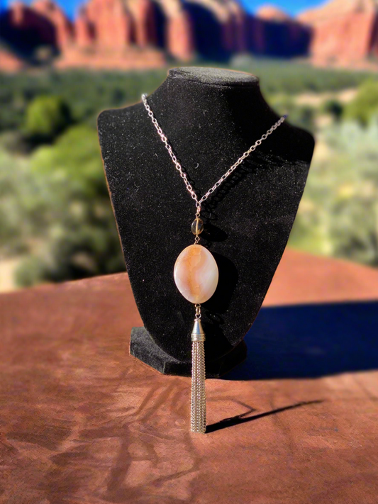 Agate pendant necklace, tassel agate jewelry, elegant gemstone necklace, bohemian agate pendant, natural stone necklace with tassel, handcrafted agate necklace, statement gemstone jewelry, unique agate pendant, agate crystal necklace, long tassel necklace, boho chic gemstone jewelry, agate healing stone necklace, earthy pendant necklace, stylish agate tassel necklace, spiritual gemstone jewelry