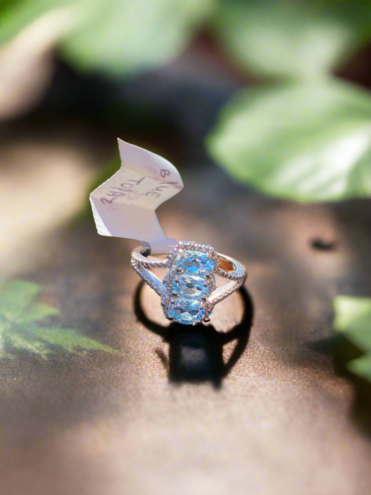 Blue topaz sterling silver ring, blue topaz radiance ring, sterling silver gemstone ring, elegant blue topaz jewelry, fine gemstone ring, affordable blue topaz ring, topaz statement ring, sterling silver band with topaz, natural blue topaz ring, calming gemstone jewelry, blue topaz birthstone ring, handcrafted sterling silver ring, unique gemstone ring, silver and topaz jewelry, blue topaz engagement ring alternative