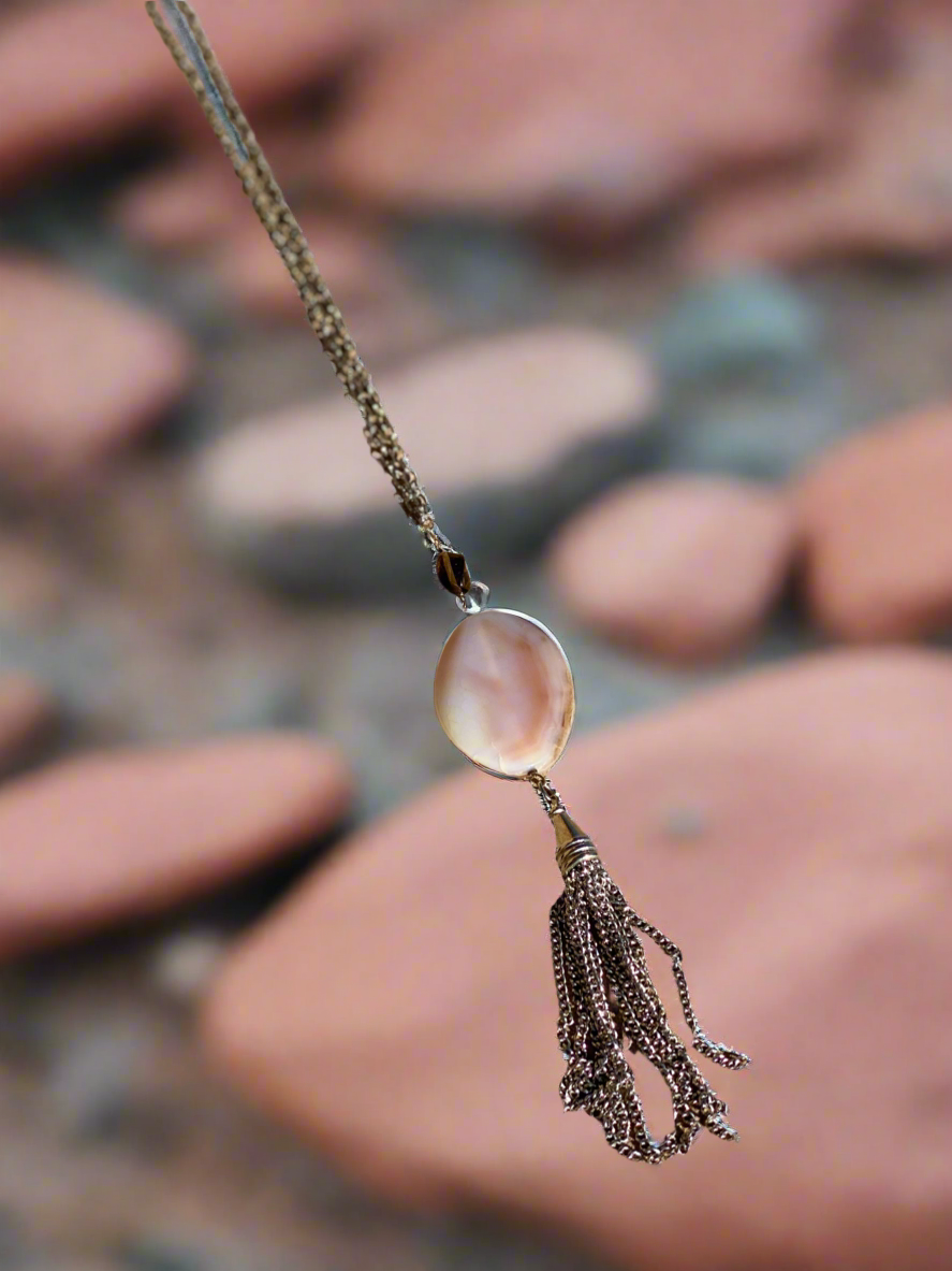 Agate pendant necklace, tassel agate jewelry, elegant gemstone necklace, bohemian agate pendant, natural stone necklace with tassel, handcrafted agate necklace, statement gemstone jewelry, unique agate pendant, agate crystal necklace, long tassel necklace, boho chic gemstone jewelry, agate healing stone necklace, earthy pendant necklace, stylish agate tassel necklace, spiritual gemstone jewelry