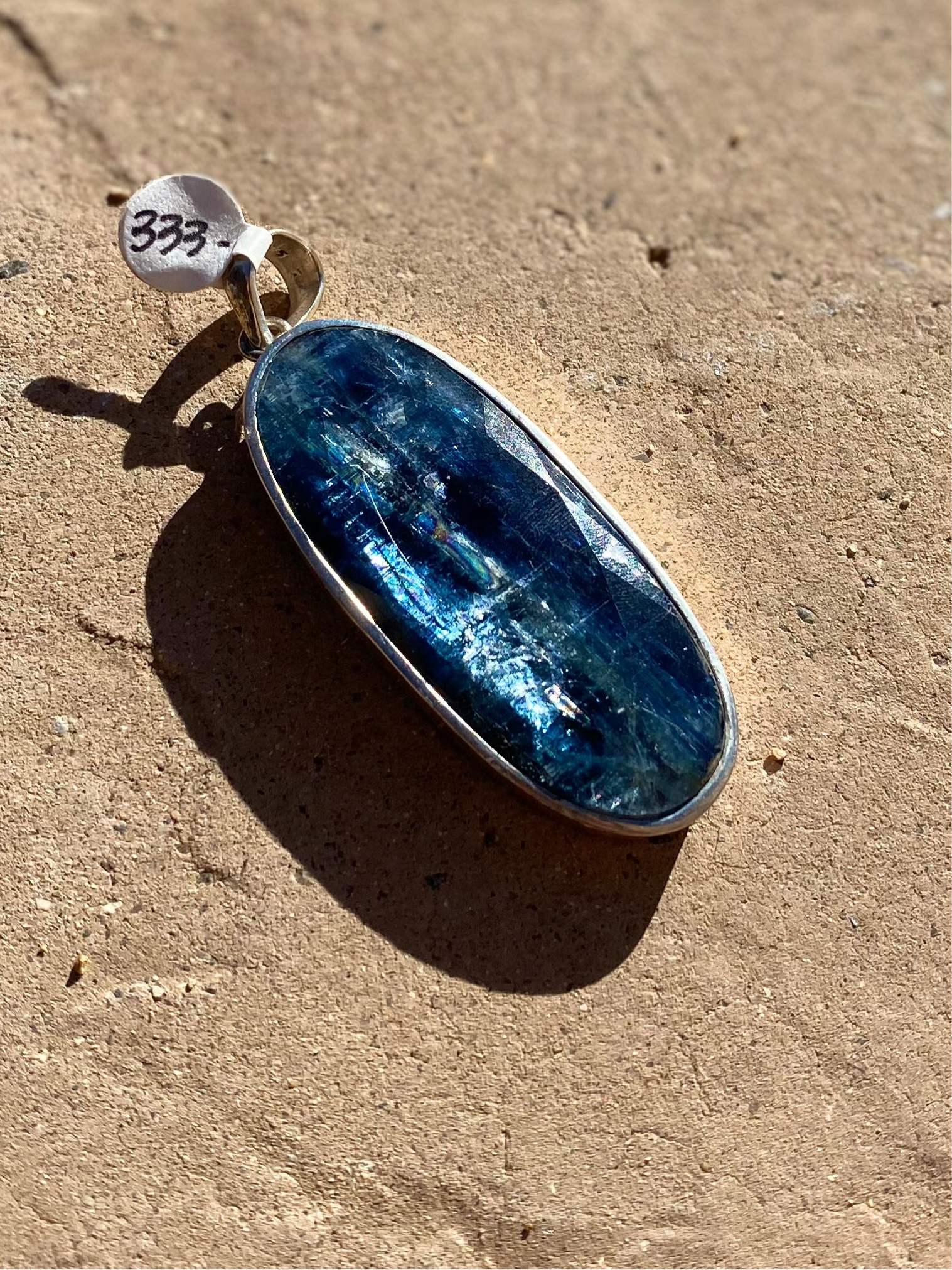 Rare blue kyanite pendant, kyanite gemstone jewelry, sterling silver kyanite necklace, natural blue kyanite charm, statement gemstone pendant, healing kyanite crystal necklace, blue kyanite for throat chakra, artisan kyanite pendant, high-vibration kyanite jewelry, unique gemstone necklace, bohemian kyanite pendant, rare crystal jewelry, kyanite energy necklace, handcrafted blue kyanite pendant, spiritual gemstone charm