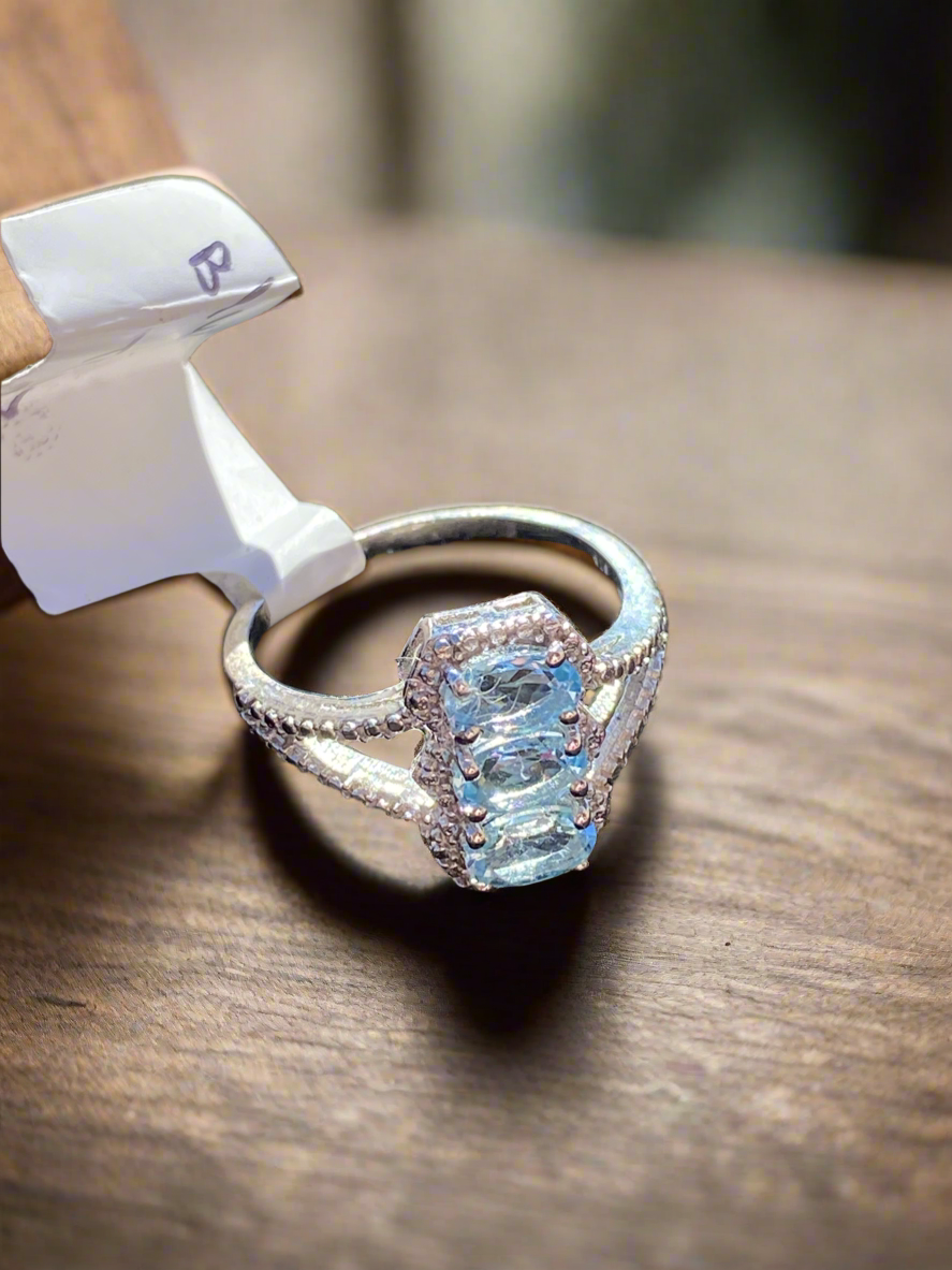 Blue topaz sterling silver ring, blue topaz radiance ring, sterling silver gemstone ring, elegant blue topaz jewelry, fine gemstone ring, affordable blue topaz ring, topaz statement ring, sterling silver band with topaz, natural blue topaz ring, calming gemstone jewelry, blue topaz birthstone ring, handcrafted sterling silver ring, unique gemstone ring, silver and topaz jewelry, blue topaz engagement ring alternative