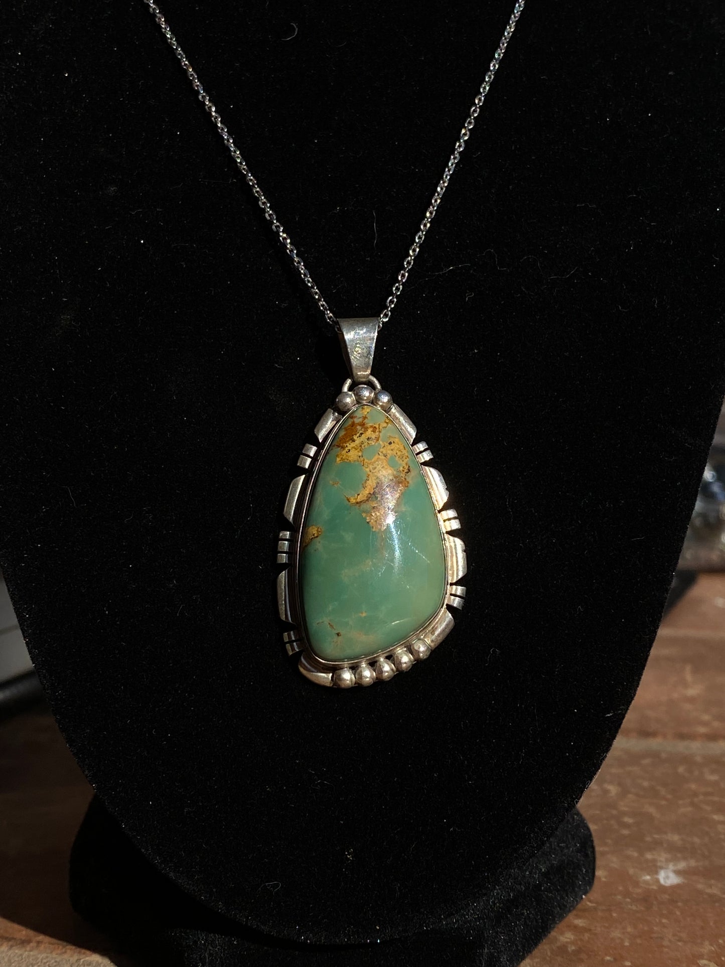 Natural green turquoise pendant, green turquoise crystal necklace, sterling silver turquoise pendant, earthy gemstone jewelry, turquoise stone necklace, bohemian turquoise pendant, healing turquoise crystal, southwestern jewelry design, handcrafted turquoise necklace, oval green turquoise pendant, unique gemstone pendant, grounding energy necklace, natural turquoise jewelry, statement turquoise necklace, green turquoise charm