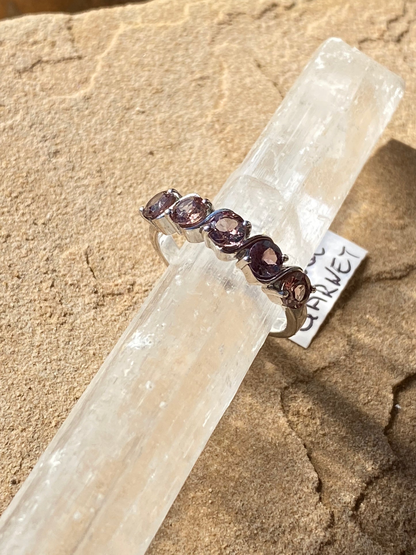 Color-changing garnet ring, garnet gemstone ring, transformative gemstone jewelry, sterling silver garnet ring, unique garnet statement ring, garnet crystal jewelry, mood-changing garnet ring, handcrafted gemstone ring, garnet for energy balance, natural gemstone ring, bohemian garnet jewelry, garnet birthstone ring, adjustable garnet ring, mystical garnet jewelry, sterling silver statement ring
