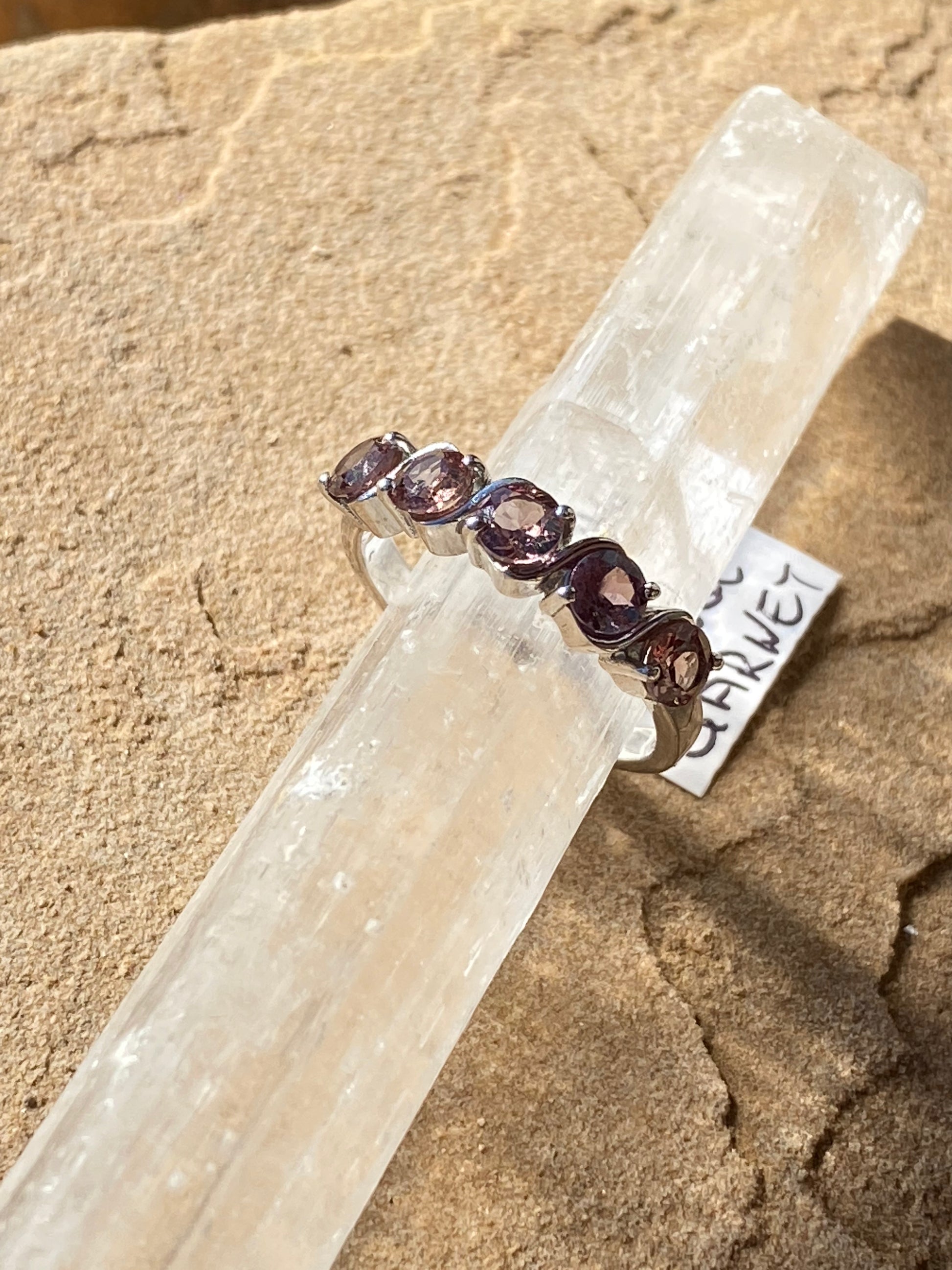 Color-changing garnet ring, garnet gemstone ring, transformative gemstone jewelry, sterling silver garnet ring, unique garnet statement ring, garnet crystal jewelry, mood-changing garnet ring, handcrafted gemstone ring, garnet for energy balance, natural gemstone ring, bohemian garnet jewelry, garnet birthstone ring, adjustable garnet ring, mystical garnet jewelry, sterling silver statement ring