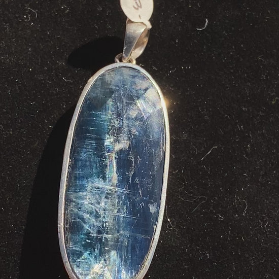 Rare blue kyanite pendant, kyanite gemstone jewelry, sterling silver kyanite necklace, natural blue kyanite charm, statement gemstone pendant, healing kyanite crystal necklace, blue kyanite for throat chakra, artisan kyanite pendant, high-vibration kyanite jewelry, unique gemstone necklace, bohemian kyanite pendant, rare crystal jewelry, kyanite energy necklace, handcrafted blue kyanite pendant, spiritual gemstone charm